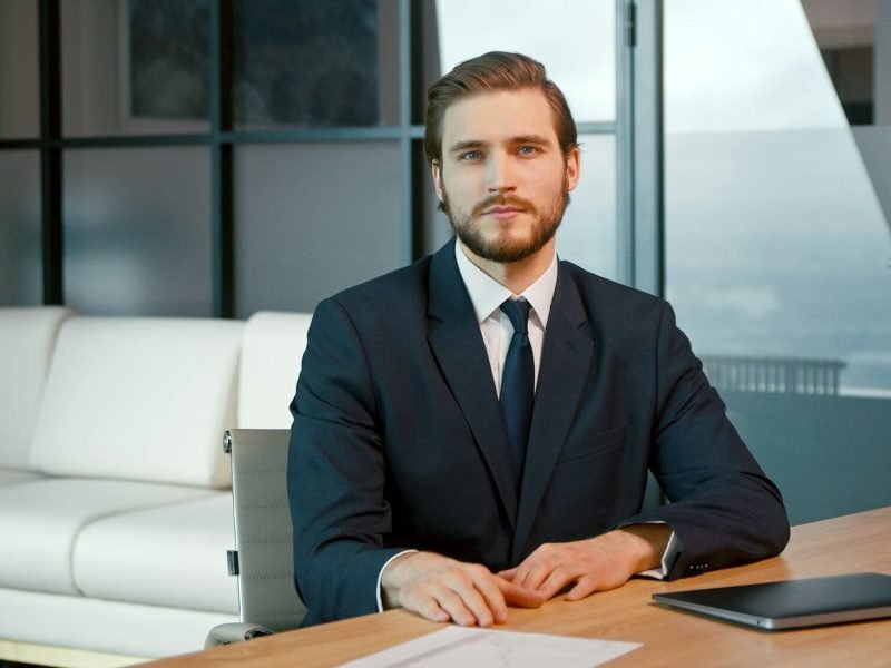 young-man-looking-at-camera-consult-client.jpg
